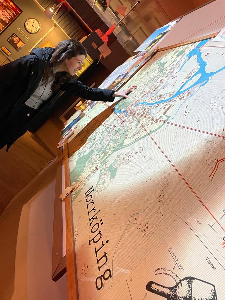 Photo of Myrto looking at maps at Arbetets museum.